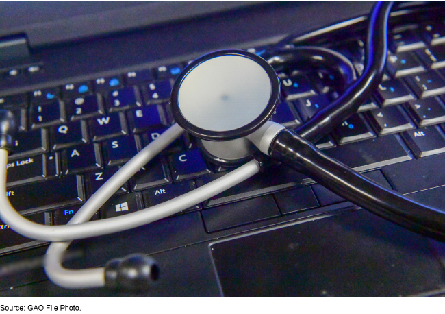 Image of stethoscope on top of a computer keyboard. 