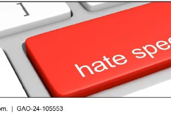 Close up of a computer keyboard. In the place of the &quot;enter&quot; key is a red colored key with the words &quot;Hate Speech&quot; on it.