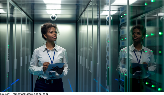 A woman checking computer systems