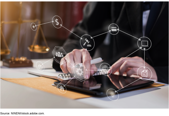 close up of someone's hands using a tablet with computer icons floating above