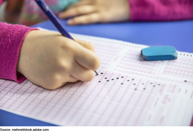 Student taking a paper-based standardized test