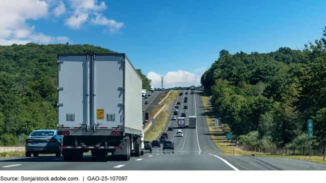 Many cars and trucks along a highway
