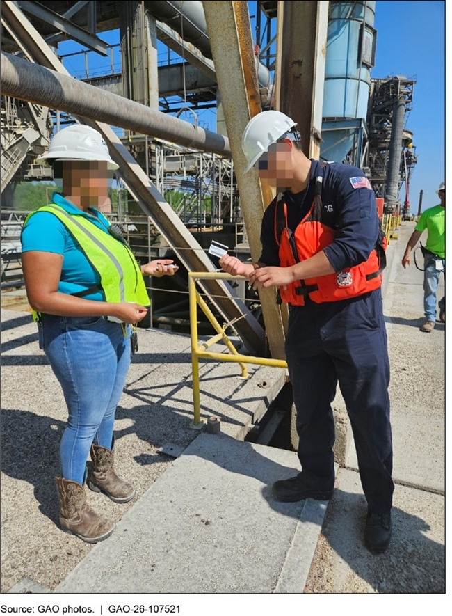 Coast Guard inspector checking credential