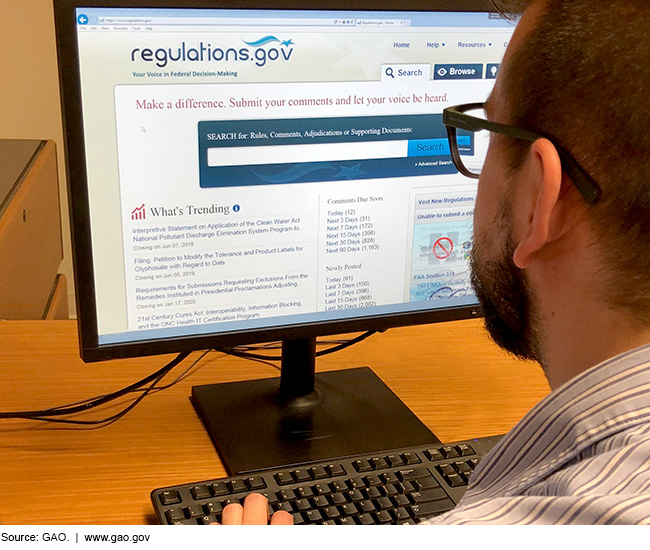 Man looking at computer monitor showing regulations.gov website