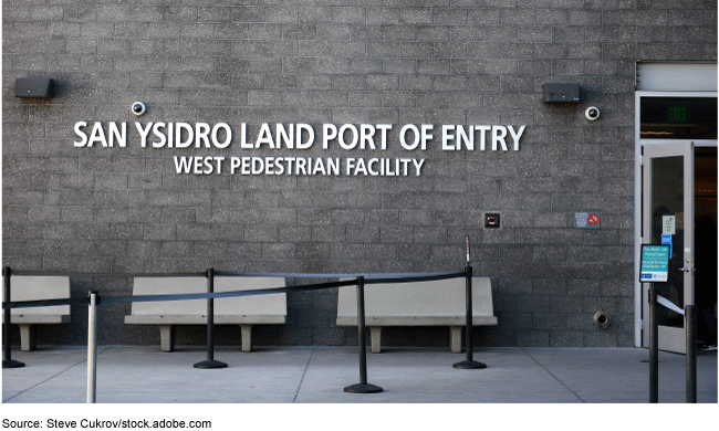 A concrete building wall that says San Ysidro Land Port of Entry, West Pedestrian Facility A concrete building wall that says San Ysidro Land Port of Entry, West Pedestrian Facility