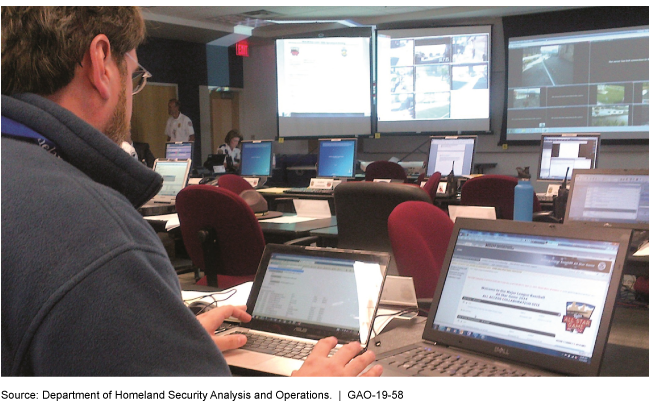 Photo of a man working on a laptop that displays information from the Department of Homeland Security's network for information sharing and collaboration. 