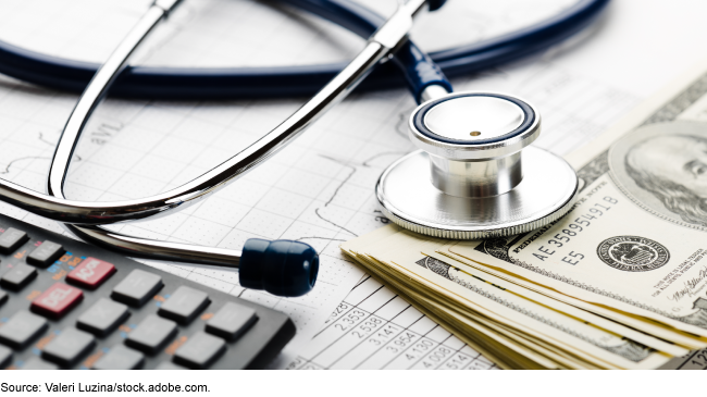 A stethoscope laying on a desk. 