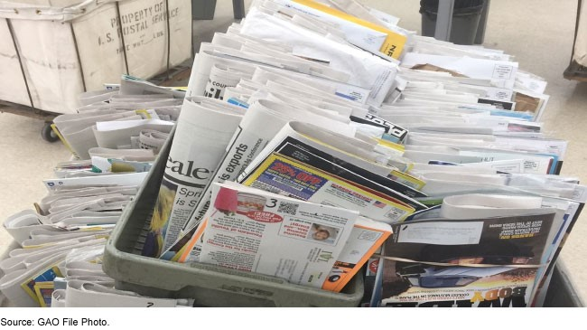 Post office bins overflowing with mail.