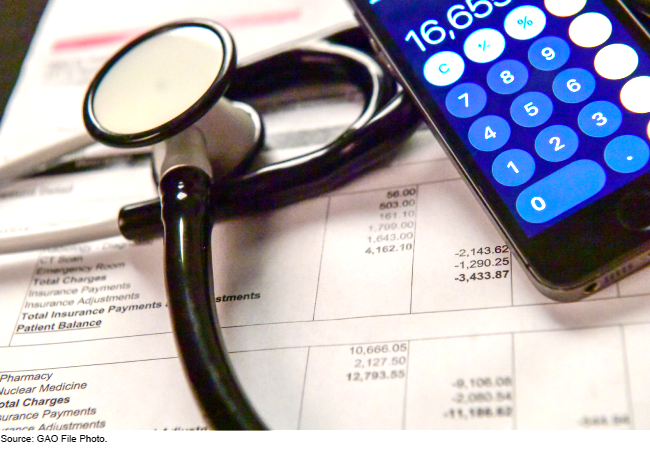 A stethoscope and calculator laying on top of an itemized medical bill A stethoscope and calculator laying on top of an itemized medical bill