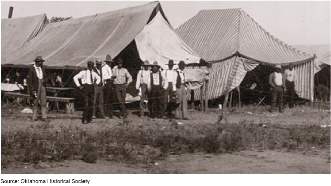 A group of people standing outside of a tent  AI-generated content may be incorrect.