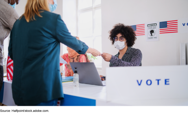 Checking in to vote while wearing a mask