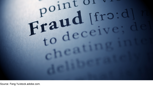 The word Fraud in bold type with the pronunciation and definition following blurred out. The word Fraud in bold type with the pronunciation and definition following blurred out.