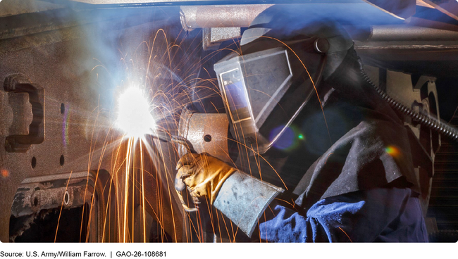 Welder repairing a ground vehicle at Anniston Army Depot.