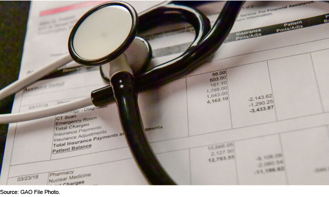 Stethoscope atop a medical bill
