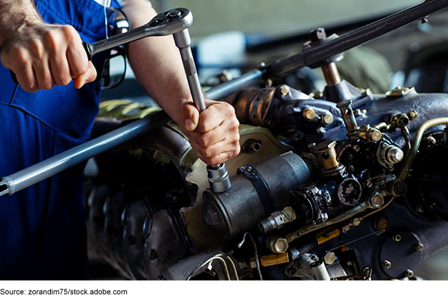 Aircraft mechanic conducting maintenance or repair work