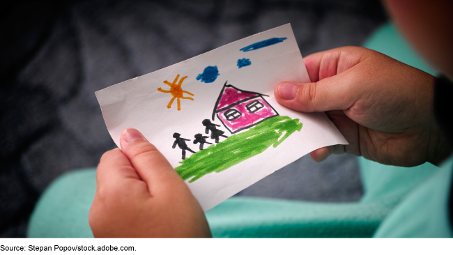 Drawing of a family next to a house