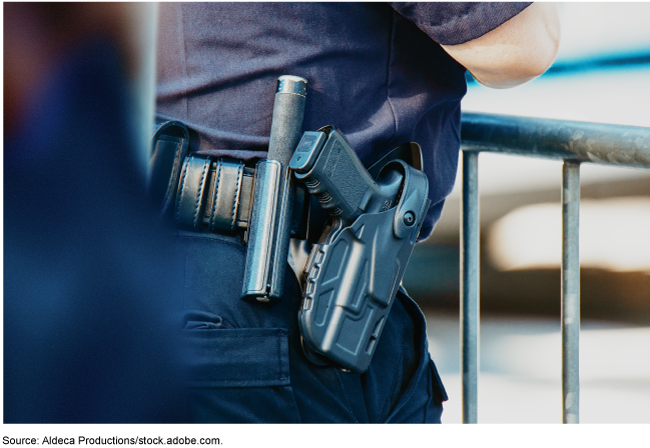 close up of a service weapon on a belt holster