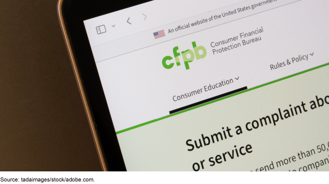Consumer Financial Protection Bureau web page on a laptop screen, showing consumer education and complaints services.