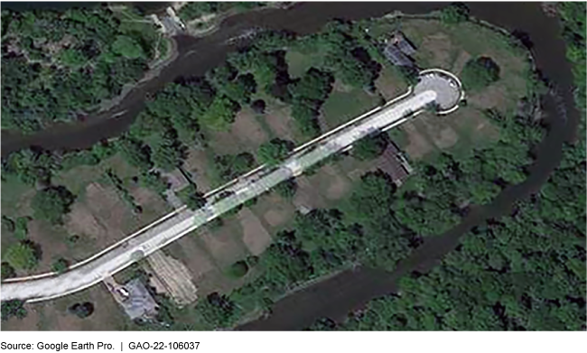 A satellite aerial view of a neighborhood cul-de-sac with nearly all houses removed.