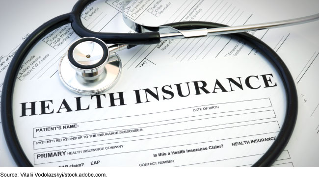 A blank form titled Health Insurance encircled by a stethoscope.