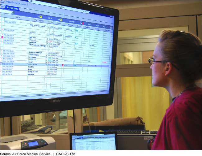 Woman reviewing records on screen