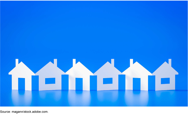 Image showing paper doll-style cutouts of houses with an electric blue background
