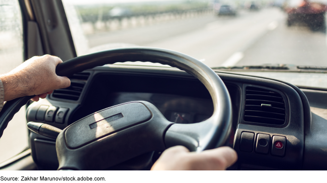 View from the driver's seat of a person driving a vehicle on a highway