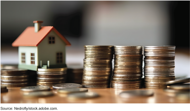 Stock image of a house and coins.
