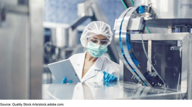 A person in a laboratory. A person in a laboratory.