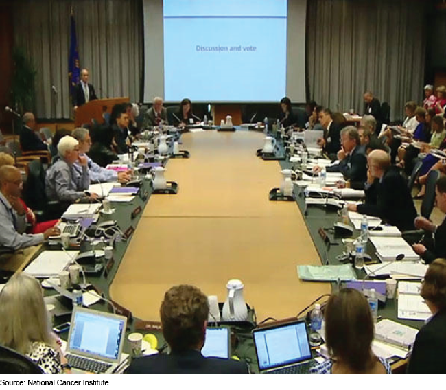 People seated around a large conference table