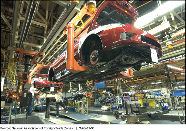 A photo showing a car being built.