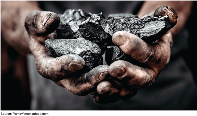 Pile of coal in man's dirty hands Pile of coal in man's dirty hands