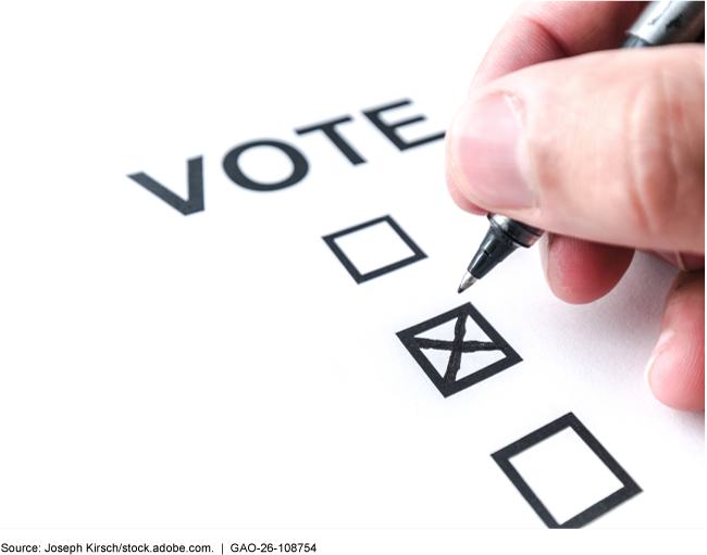 A person places an x inside a square to cast a vote.