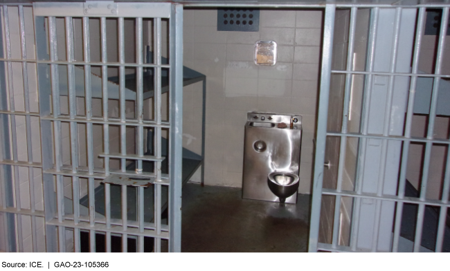 bunks beds and a toilet in a housing cell