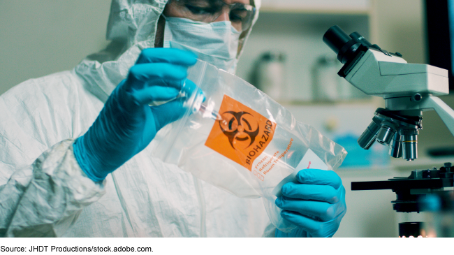 Image of a technician with biohazard bag