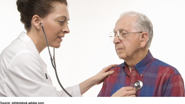 Person using a stethoscope on an elderly person Person using a stethoscope on an elderly person