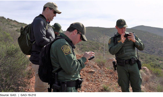 A photo of border security agents using R&D technology. 