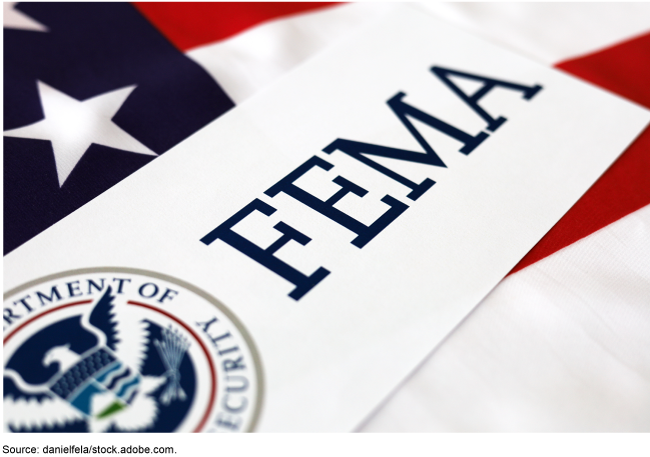 FEMA seal on top of the American flag