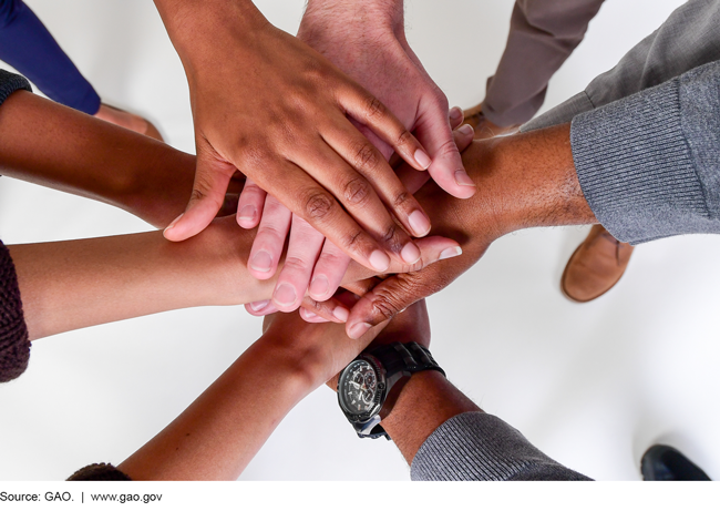 Aerial view of hands on top of one another