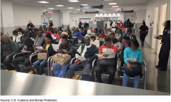 Humanitarian parole beneficiaries await processing at John F. Kennedy International Airport.