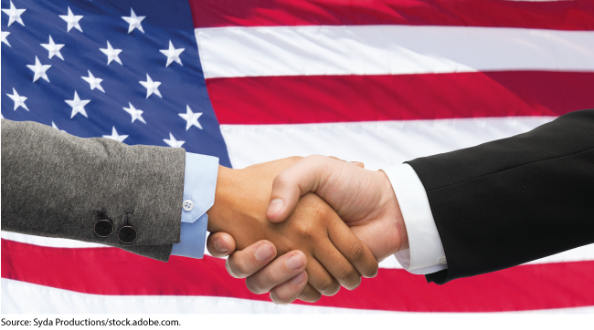 Handshake in front of American flag