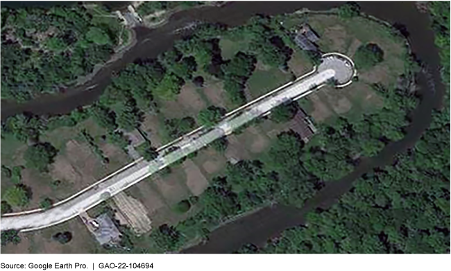 A satellite aerial view of a neighborhood cul-de-sac with nearly all houses removed.