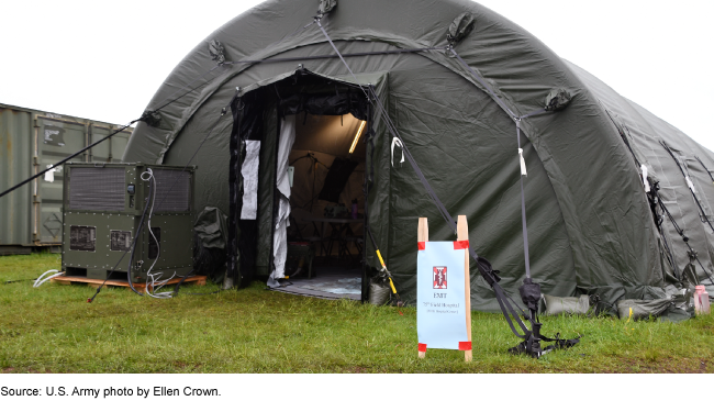 An exterior view of the entrance to a U.S. Army field hospital. An exterior view of the entrance to a U.S. Army field hospital.