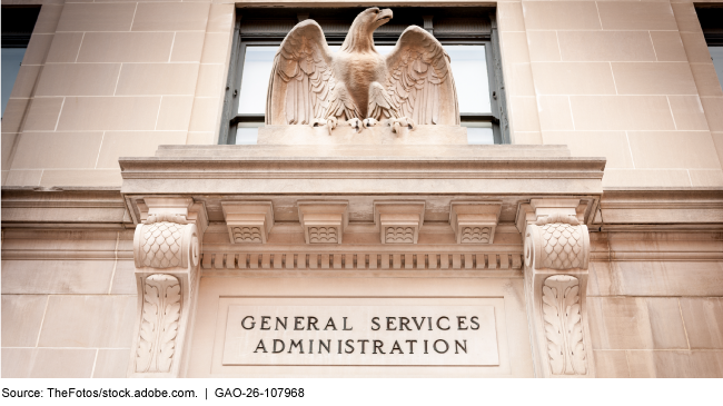 A light-colored stone building facade with a sculpture of an eagle above the words General Services Administration A light-colored stone building facade with a sculpture of an eagle above the words General Services Administration