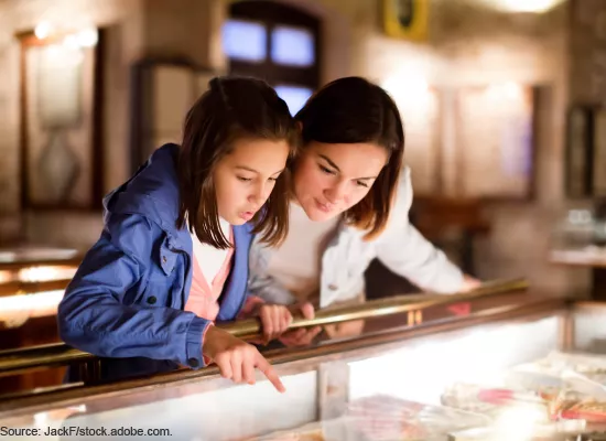 A mother and daughter in a museum