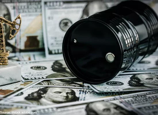 Graphic of an oil barrel on top of money