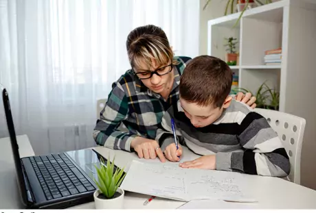 Image showing mother and son learning remotely