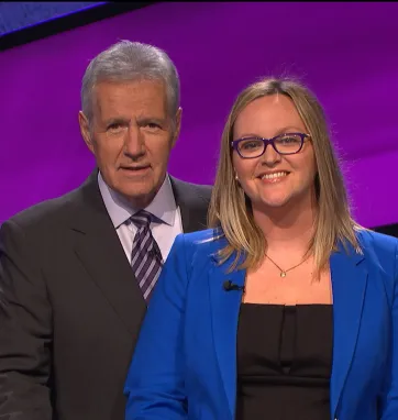 Ashley Alley and Alex Trebek pose for a photo at the Jeopardy studios 
