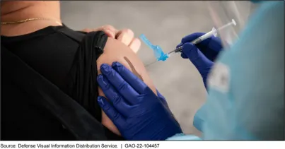 Photo showing a woman receiving a vaccination in her upper arm