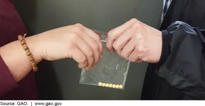 Close up photo of two hands of two different young people exchanging controlled substances.